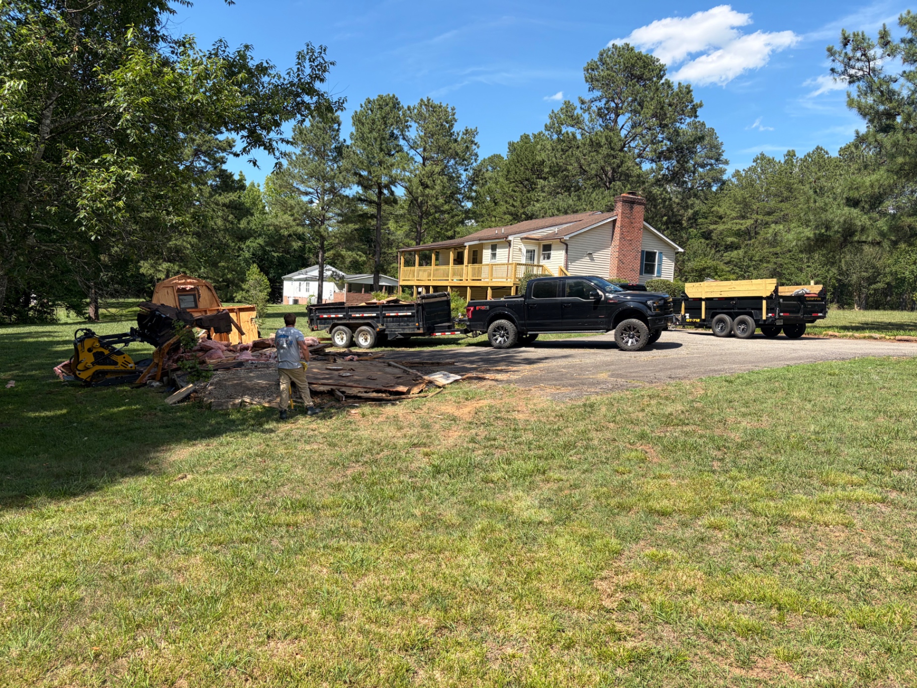 Smiley's crew clearing debris from a residential property